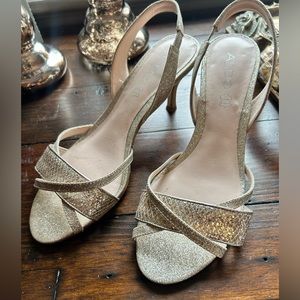 Gold sparkly heels.